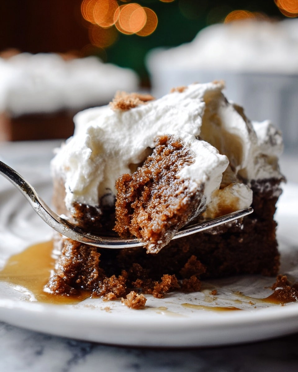 A square piece of sticky brown cake with a shiny caramel-like glaze is placed on a white plate with a dark green leaf pattern smudged across it. The cake looks moist and crumbly with some crumbs scattered around and a small puddle of caramel sauce beside it. A black spoon lies next to the cake on the plate. Above the plate, there is a rectangular white baking dish with a missing piece of the same cake, showing the thick gooey caramel sauce underneath the soft, spongy top layer dusted with powdered sugar. Powdered sugar is lightly dusted around on a dark surface where a copper gingerbread man-shaped cookie cutter lies. The photo taken with an iphone --ar 4:5 --v 7