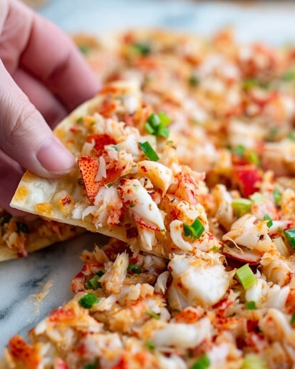 The image shows a large white tray filled with crispy golden brown tortilla chips as the base layer, topped with a thick layer of creamy white sauce drizzled in a zigzag pattern. Over this, there is a scattered mix of finely chopped white and red crab sticks, small dark brown crunchy bits, and bright green sliced green onions spread evenly across the whole tray. The tray is set on a white marbled surface with a small white bowl partially visible on the right and a wooden bowl holding chopped green onions in the upper part of the photo. photo taken with an iphone --ar 4:5 --v 7