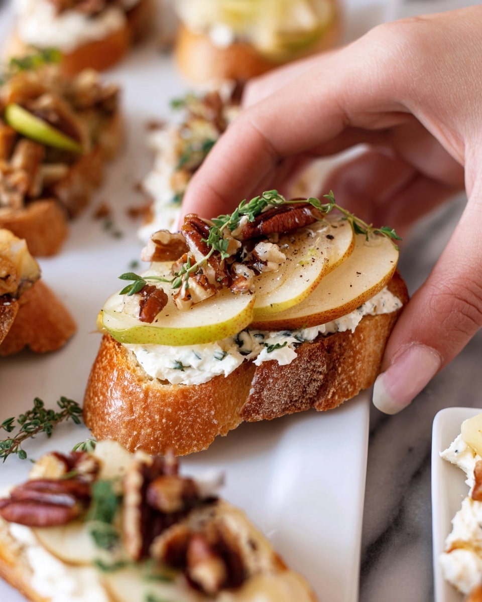 Two pieces of toasted bread sit on a white rectangular plate over a white marbled surface. Each toast is topped with three thin slices of golden-brown pear, slightly translucent with specks of pepper. On top of the pears is a dollop of white creamy cheese, also sprinkled with black pepper. A small sprig of green thyme decorates each toast. Drops of honey or syrup are visible on and around the toasts, adding a glossy shine. photo taken with an iphone --ar 4:5 --v 7