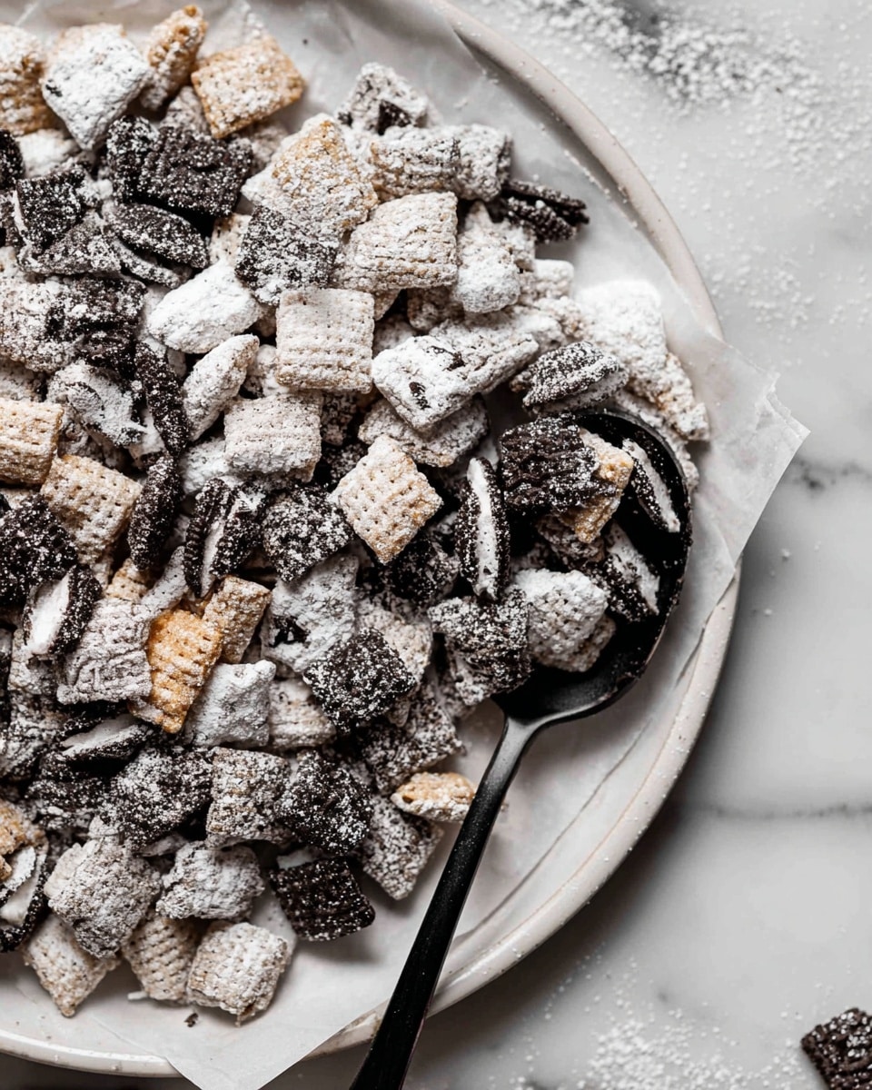 A close-up view of a baking tray filled with a mix of black and white snack pieces. There are three main layers: the first is white puffed cereal pieces with a rough texture, the second layer has dark chocolate cookie pieces broken into halves or smaller chunks, and the third layer consists of nut clusters covered in a white powdery coating. All pieces are mixed together and dusted evenly with a white powder, giving a snowy look. A black spoon rests on the right side of the tray, partially covered by the snacks. The tray sits on a white marbled surface. photo taken with an iphone --ar 4:5 --v 7