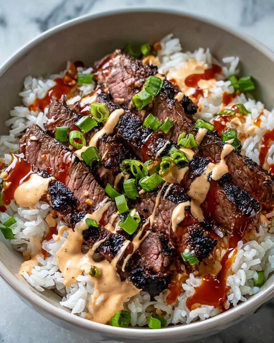 A white bowl filled with a base layer of cooked white rice that looks soft and slightly sticky. On top of the rice, there are several slices of grilled steak with a dark charred outer edge and a pink tender inside, arranged in a row at the center. Drizzled over the steak and rice are two sauces: a creamy beige sauce and a glossy dark red sauce. Scattered green onion pieces add a fresh bright green color on top. The bowl sits on a white marbled surface. Photo taken with an iphone --ar 4:5 --v 7