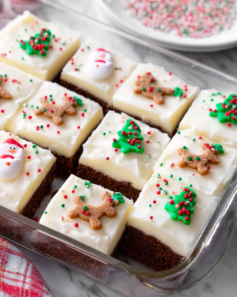 This image shows nine square pieces of cake inside a clear glass baking dish on a white marbled surface. Each cake piece has two layers: a thick, dark brown bottom layer with a soft, crumbly texture, and a thick top layer of smooth white frosting. The frosting is decorated with small colorful Christmas-themed icing figures including reindeer, Santa Claus, Christmas trees, and gingerbread men, all spaced one per cake piece. Additionally, there are small red, green, and white round sprinkles scattered across the frosting. In the background, there is a white plate with some sprinkles on it. Photo taken with an iphone --ar 4:5 --v 7