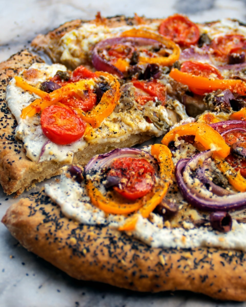 A pizza with one main layer of thin, golden-brown crust that has a slightly uneven, bubbly edge and some charred spots. On top, there is a spread of black sauce or spread, giving a dark texture base. Scattered over it are various toppings: thin slices of light brown mushrooms, small red cherry tomato halves, bright orange and yellow thin pepper rings, pale purple onion rings, and small chunks of white cheese sprinkled unevenly. The pizza sits directly on a dark baking surface. The photo taken with an iphone --ar 4:5 --v 7