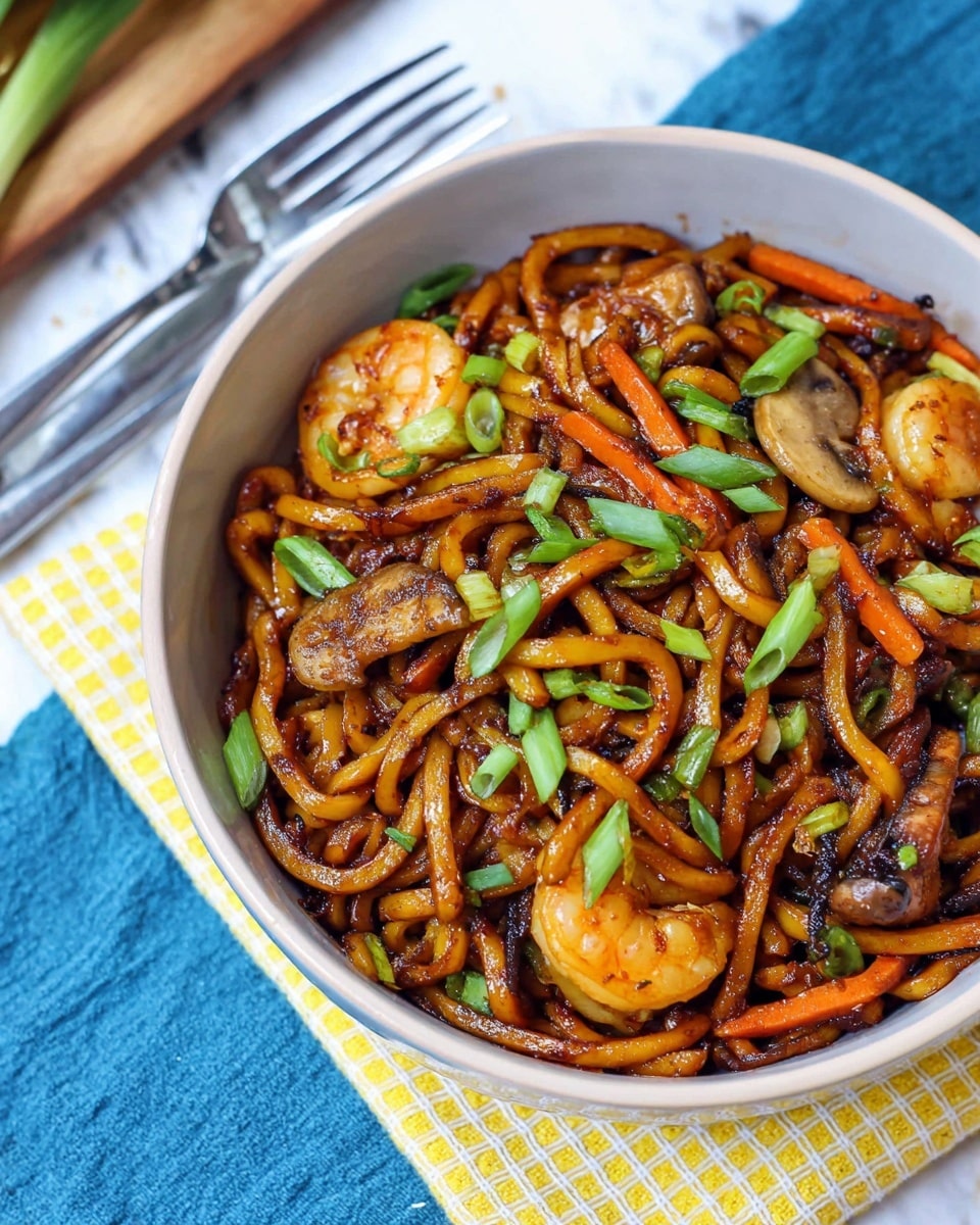 A close-up of a white bowl filled with stir-fried thick noodles that are dark brown from the sauce, mixed with sliced carrots that are orange and thin, light brown mushroom slices, and small shrimp with a slightly golden color. Bright green chopped spring onions are sprinkled evenly on top, adding freshness. The bowl sits on a yellow and white checkered cloth, placed on a white marbled surface, with a blue cloth partially visible underneath and two forks resting nearby. photo taken with an iphone --ar 4:5 --v 7
