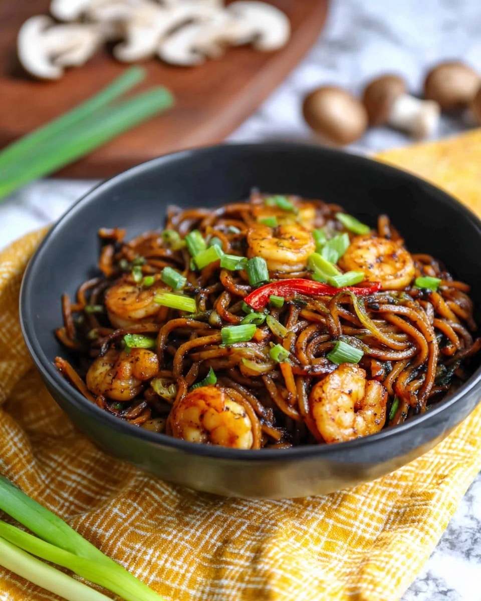 A black bowl is filled with thick, dark brown noodles mixed with grilled shrimp that have a light golden color with char marks. Scattered among the noodles are thin slices of vegetables including light green scallions and red pepper strips. The dish is garnished with fresh green chopped scallions on top. The bowl sits on a yellow and white checkered cloth over a white marbled surface. In the background, there are blurred green onions and sliced mushrooms on a wooden board. Photo taken with an iphone --ar 4:5 --v 7