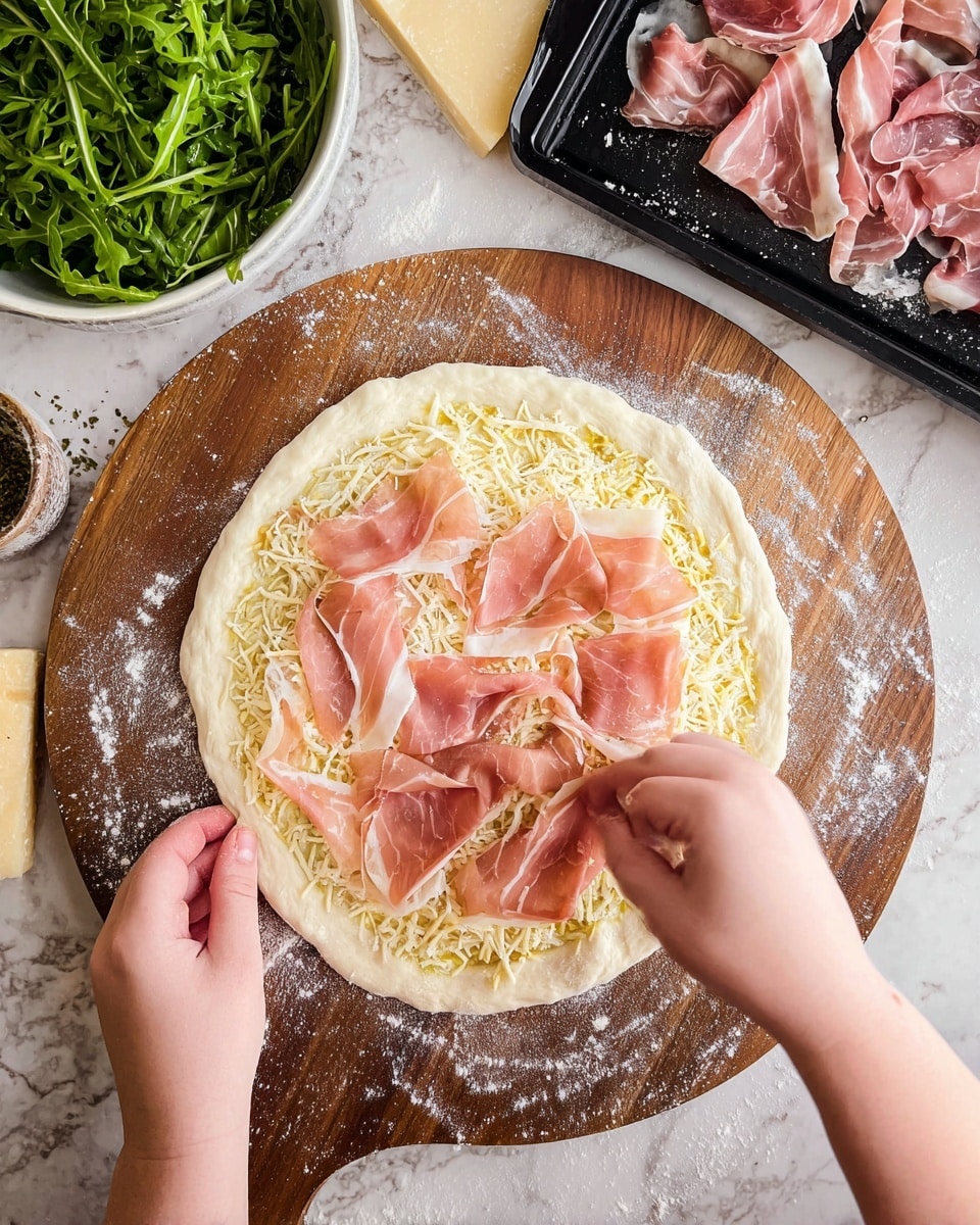 A round pizza with a golden-brown crust that looks thick and fluffy, topped with white melted cheese spread across the surface. On top of the cheese are thin, folded slices of pinkish-brown cured meat, scattered evenly around the pizza. Small green herb leaves are sprinkled all over, adding a fresh touch. The pizza is placed on a wooden board next to a small white bowl with a golden liquid inside. The background shows a white marbled texture with a light beige cloth and herb sprigs nearby. Photo taken with an iphone --ar 4:5 --v 7