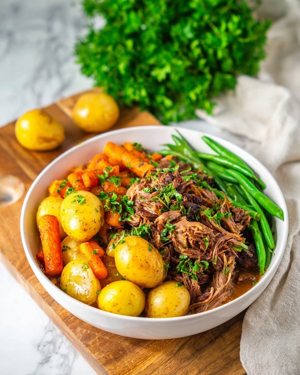 A white plate filled with three main layers: on the left side, a pile of vibrant green beans with a smooth texture; centered and right, a mix of shredded, dark brown beef slow-cooked with golden yellow baby potatoes and bright orange carrot chunks, all mixed in a glossy, slightly thick brown sauce with bits of green herbs sprinkled on top, sitting on a wooden surface with a blurred background of green herbs and white kitchenware; photo taken with an iphone --ar 4:5 --v 7