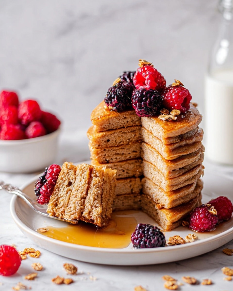 A close-up view of a sandwich being dipped into a white ramekin filled with dark brown broth. The sandwich has three visible layers inside a golden-brown hoagie-style bun with a slightly textured crust: the bottom layer is shredded dark brown beef, the middle layer consists of light green pickled peppers, and the top layer is melted white cheese. A woman's hand is holding the sandwich from the top, slightly pressing the bun as it is dipped into the broth. In the background, there is another sandwich and a striped cloth on a white marbled surface. Photo taken with an iphone --ar 4:5 --v 7