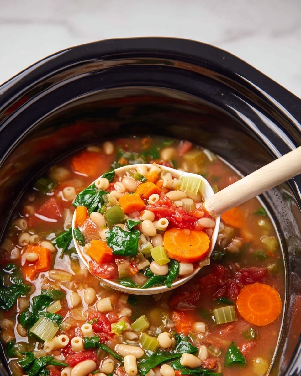 A close-up view of a black slow cooker filled with colorful vegetable soup, showing multiple layers including bright orange carrot slices, white beans, small round pasta, chopped green spinach, diced red tomatoes, celery pieces, and translucent onion chunks, all mixed in a clear broth. A white spoon with a wooden handle is scooping up a portion of the soup, displaying the varied textures and vibrant colors of the vegetables and pasta against the smooth, glossy black edge of the cooker. The background surface is a white marbled texture. photo taken with an iphone --ar 4:5 --v 7