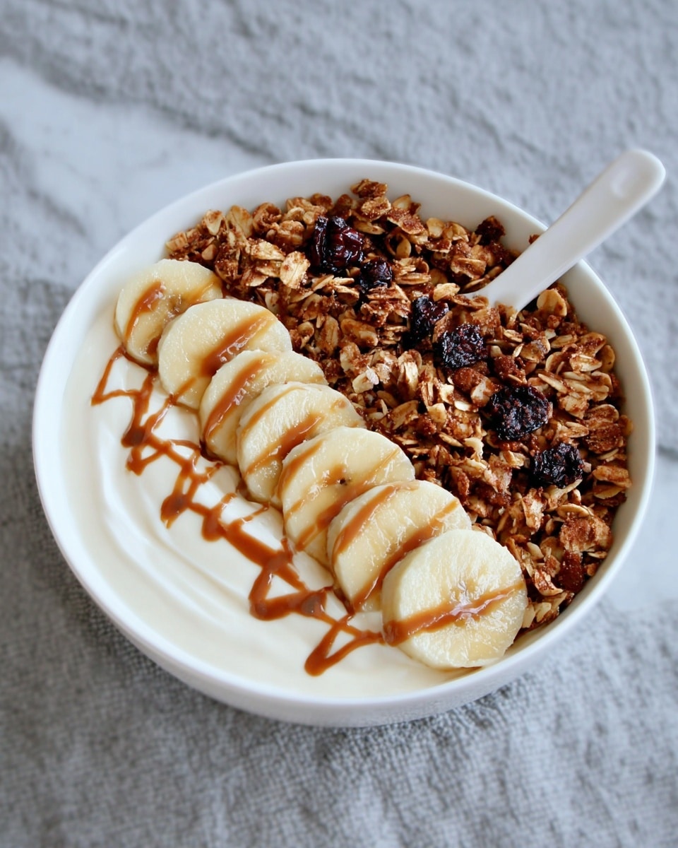 A white bowl filled with one layer of crunchy granola made of mixed oats, nuts, and dried fruit pieces in shades of light brown, dark brown, and reddish tones, showing a rough and chunky texture. The bowl sits on a white marbled surface. photo taken with an iphone --ar 4:5 --v 7